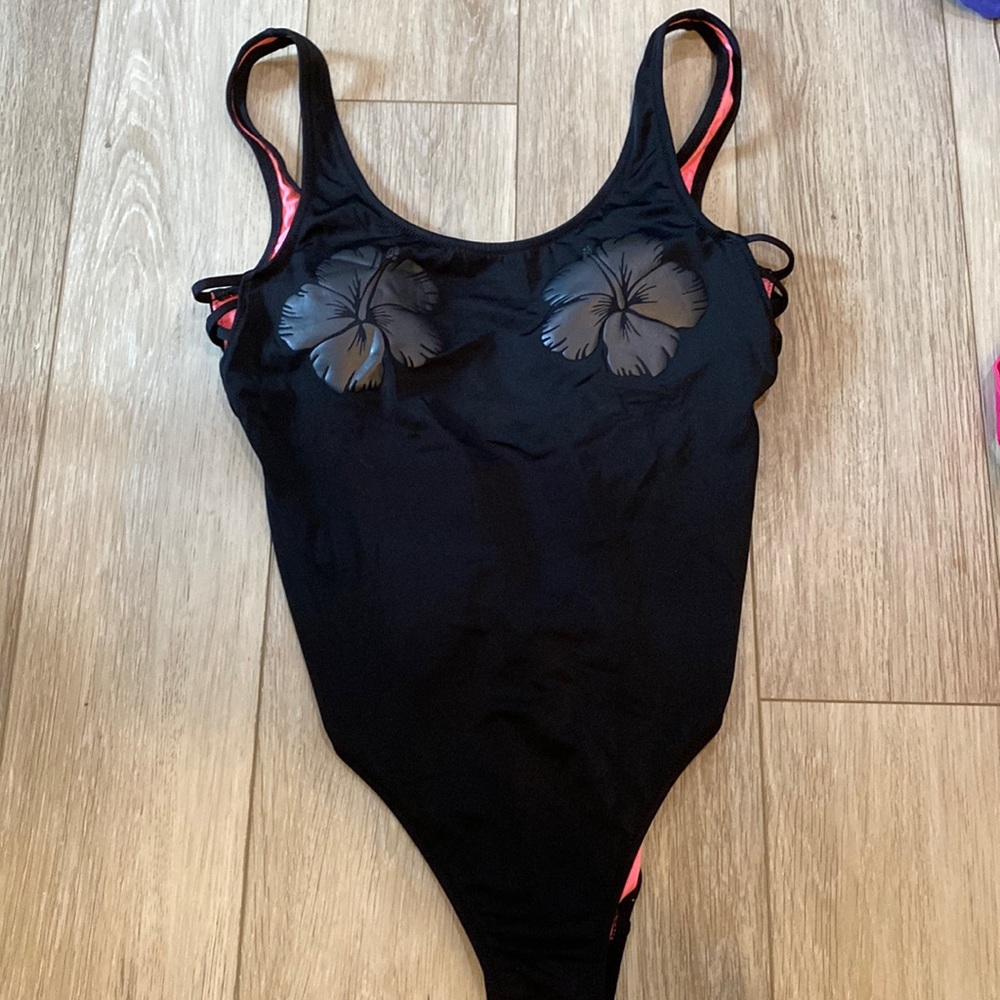 Never worn pink one piece bathing suit